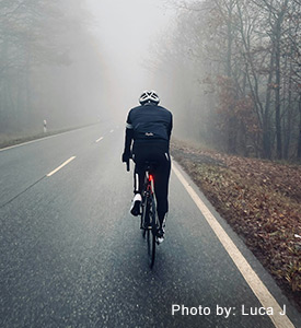 Bicyclist on foggy road